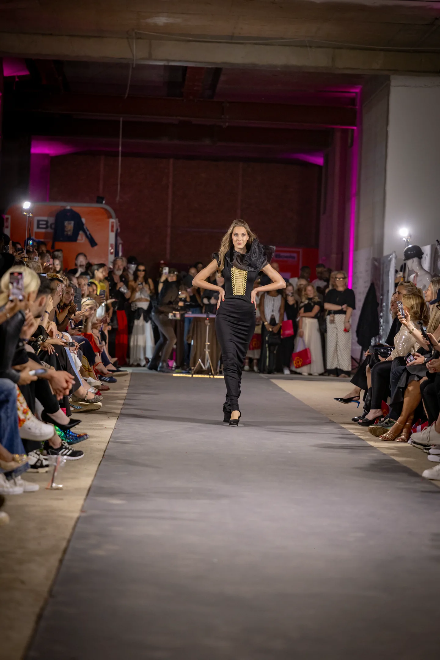 Couture runway moment with corseted gold detail.